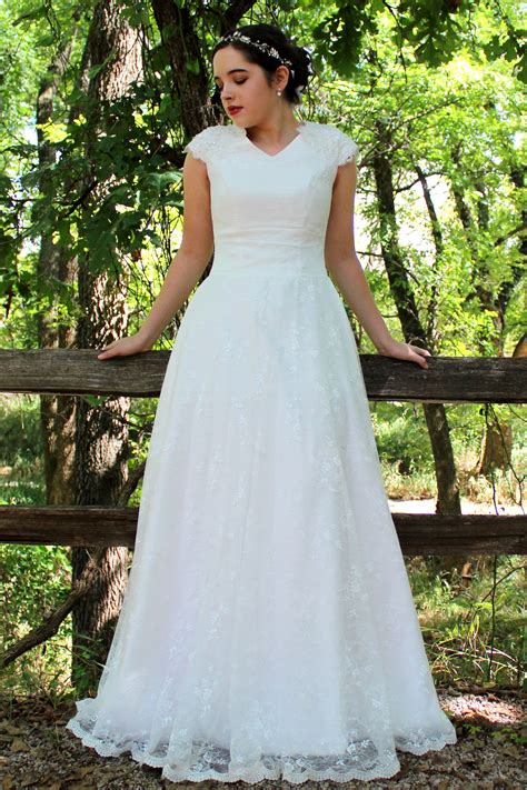 The largest collection of modest wedding dresses in the world for our conservative brides plus all the latest styles and trends available in the gateway wedding collection, all available at latterdaybride, a bridal shop in salt lake city with worldwide shipping. Rosalyn Lace Modest Wedding Dress with Sleeves