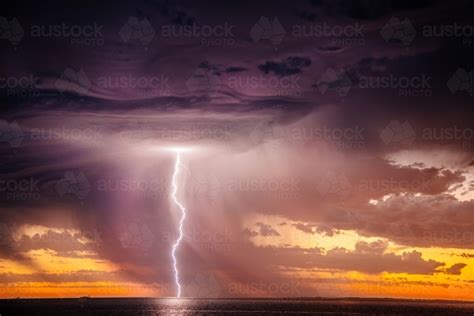 Image Of Sunset Lightning Bolt And Stormy Sky Over The Ocean Austockphoto