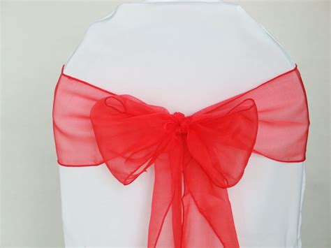 Simply choose your favorite fabric and celebrate in style! Red Organza chair sashes - Govinda Events & Decoration Hire
