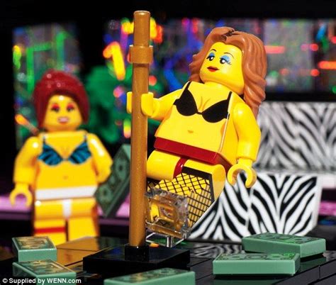 Two Legos Are Standing Next To Each Other In Front Of A Television Screen With Neon Lights