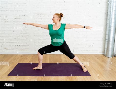 Portrait Of Young Attractive Yoga Teacher Practicing Standing In