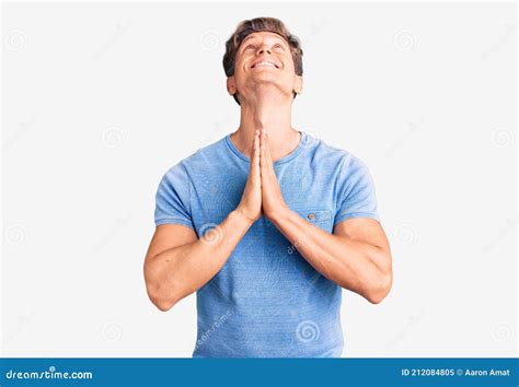 Young Handsome Man Wearing Casual Clothes Begging And Praying With