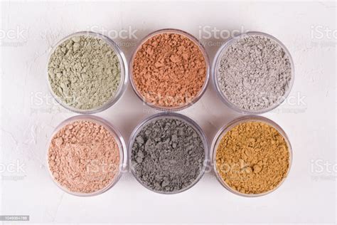 Set Of Different Cosmetic Clay Mud Powders On White Background Stock