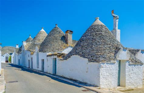 View Of Traditional White Trulli Houses In Alberobello In Puglia Italy