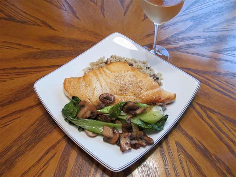 Pan Seared Chilean Sea Bass Over An Herb Couscous With A Bok Choy And Mushroom Medley The Wine