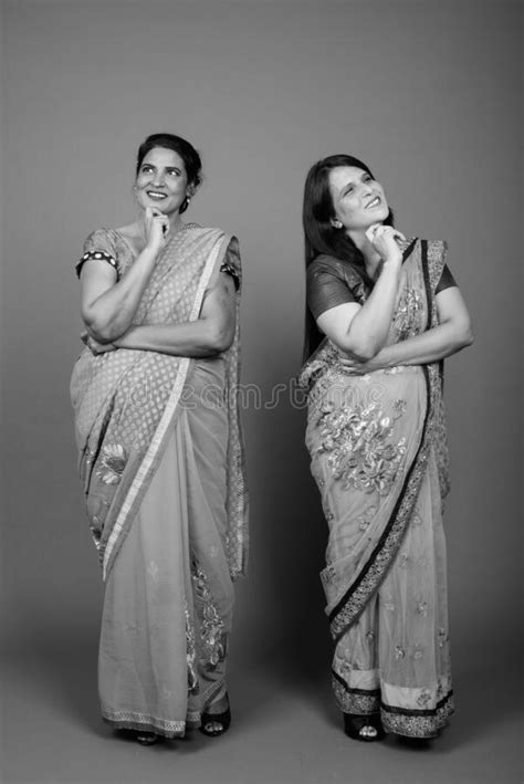 Two Mature Indian Women Wearing Sari Indian Traditional Clothes Together Stock Image Image Of