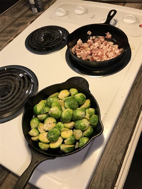 Sprinkle with salt and pepper. Soon to be baked Brussels sprouts with bacon bits and ...