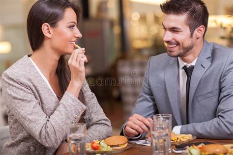 Business Colleagues Having Conversation During Coffee Break Stock Image