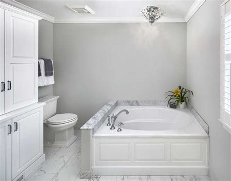 A stunning marble master bathroom by logan killen interiors features luxurious organic details. Plain & Fancy Custom Vintage Raised Panel White Cabinets