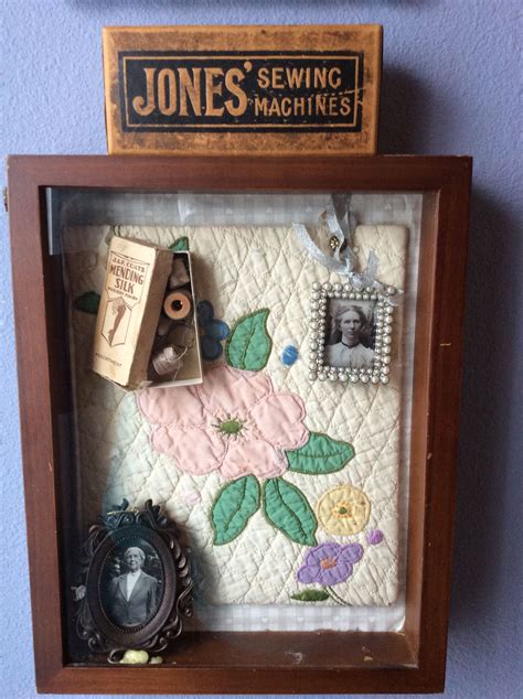 Great-grandmother's shadow box with piece of quilt she made. | Shadow