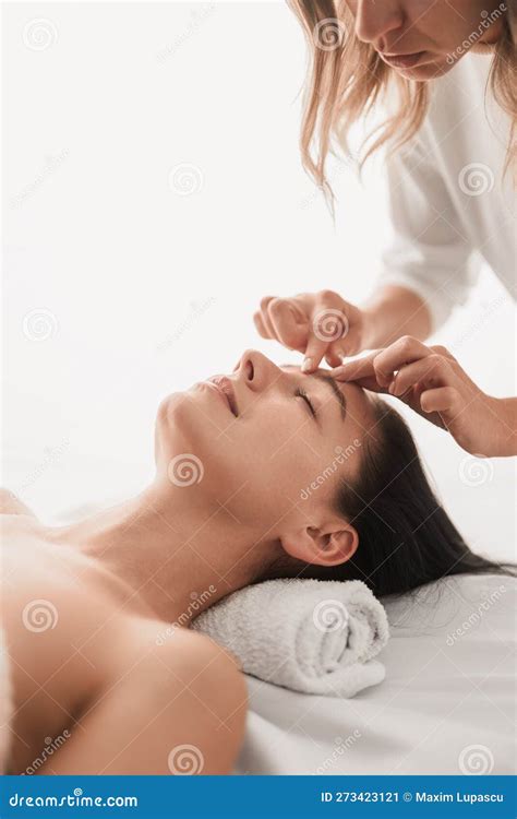 Crop Masseuse Massaging Face Of Client In Spa Salon Stock Image Image Of Beautician Couch