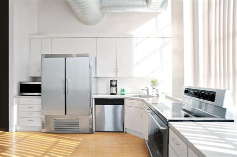 One row of high slender cupboards and use the top for display. Get Ideas for L-Shaped Kitchens