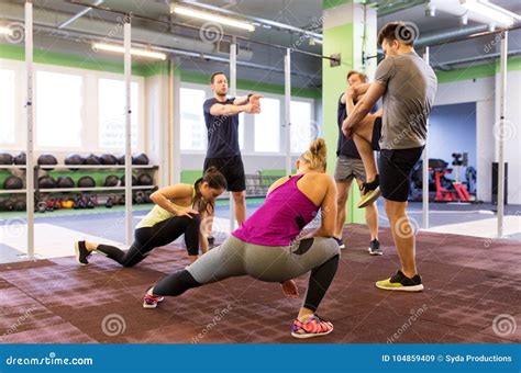Group Of Happy Friends Stretching In Gym Stock Image Image Of Person