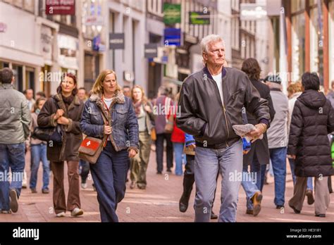 Amsterdam Netherlands People Stroll On Kalverstraat In Downtown