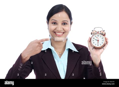 Young Business Woman With An Alarm Clock Stock Photo Alamy