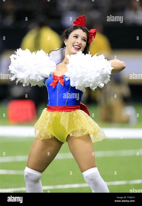 a new orleans saints cheerleader entertains the crowd during a break in the game with the