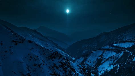 Snow Covered Mountain With Background Of Dark Sky And Moon During