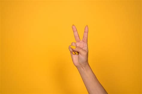 Premium Photo Female Hand Showing Peace Sign