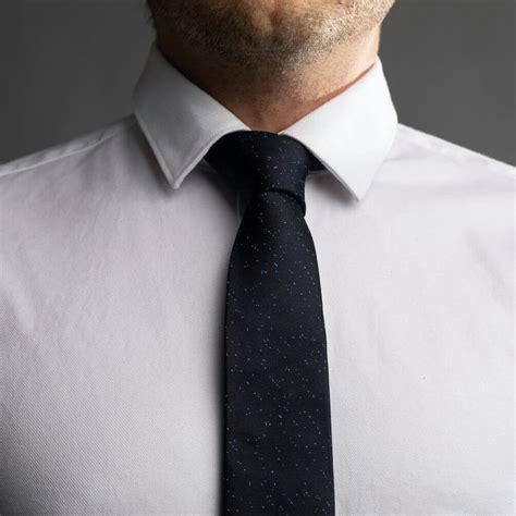 When you're tying a tie make sure to use a knot that isn't too big for the collar of the shirt or vice versa. How to Tie a Half Windsor Knot - The Modest Man