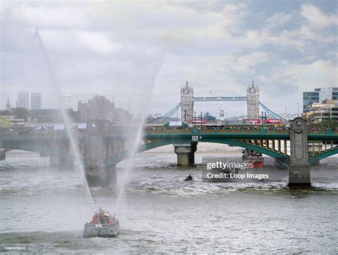 a fireboat passes under southwark bridge during the thames festival news photo getty images
