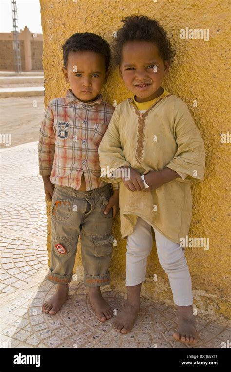 Two Children See Shyly In The Camera Hi Res Stock Photography And