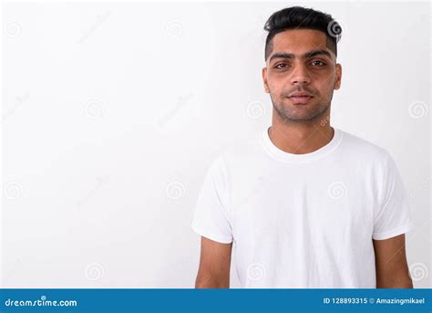 Young Indian Man Wearing White Shirt Against White Background Stock