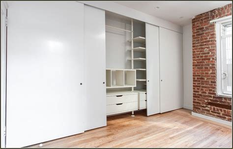 Empty room with white walls and wardrobe closet. Long Sliding | Sliding closet doors, Discount bedroom ...