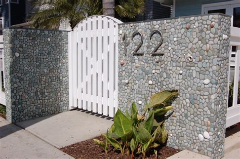 He mounted the tiles with screws directly on the concrete wall to create a ikea runnen wall fence. Green Outdoor Pebble Tile Wall - Modern - Entry - Hawaii ...