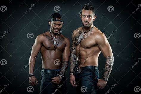 Machos With Muscular Tattooed Torsos Look Attractive Dark Background Masculinity Concept Stock