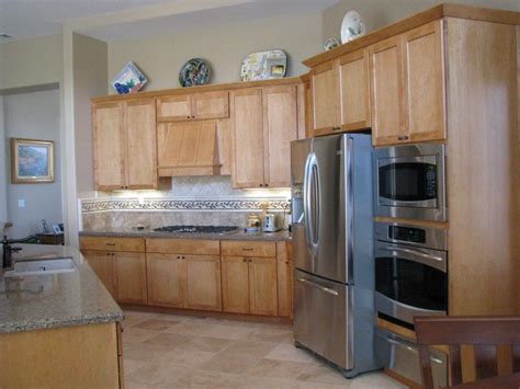 Kitchen remodel ideas on a budget, layout, before and after, backsplash, small, top 10, modern, popular on 2018 #kitchenremodelideas #kitchendesign. Grey Quartz Countertops And Natural Wood Kitchen Cabinets ...