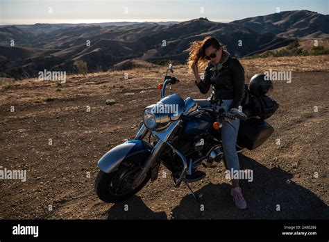 Woman Biker Sitting On Her Motorcycle Stock Photo Alamy