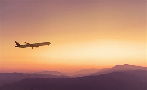travel, airplane in sunset sky - Unbridled