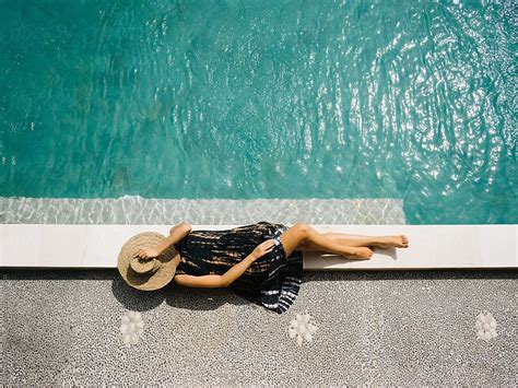 Female Lying Near Pool Del Colaborador De Stocksy Dreamwood