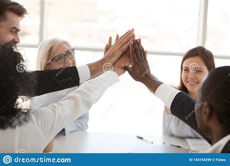 High Five For Success Concept Diverse Group Of Smiling Happy