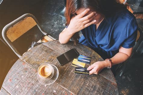 Premium Photo Closeup Image Of An Asian Woman Get Stressed And Broke While Holding Credit Card