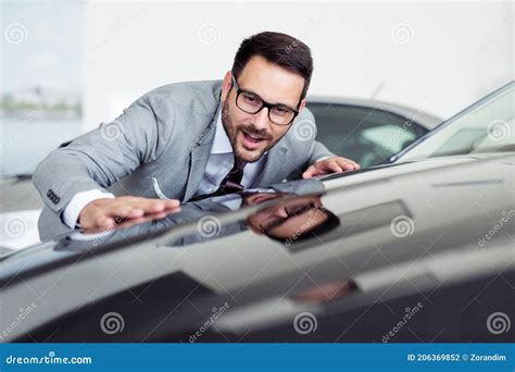 Business Man Is Choosing A New Vehicle In Car Dealership Stock Photo