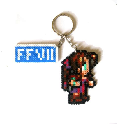 A Keychain With An Image Of A Person Holding A Nintendo Wii Game Controller