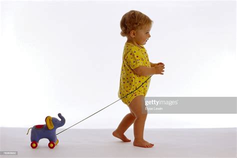 Child Pulling A Toy High Res Stock Photo Getty Images