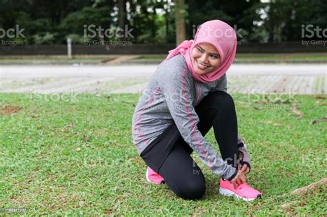 A Muslim Woman Preparing Herself Before Running Stock Photo Download