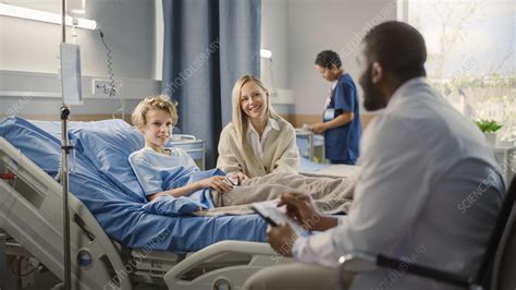 Mother Visiting Son In Hospital Stock Image F Science Photo Library