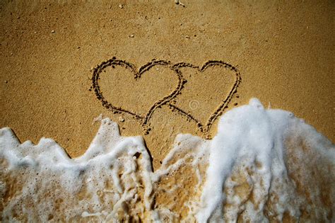 Two Hearts Drawn On Sand Of A Beach Stock Image Image Of Heart
