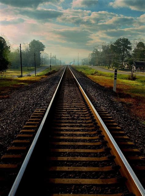 The rail road tracks creating a one point perspective leading into Waycross,GA, a small rural ...