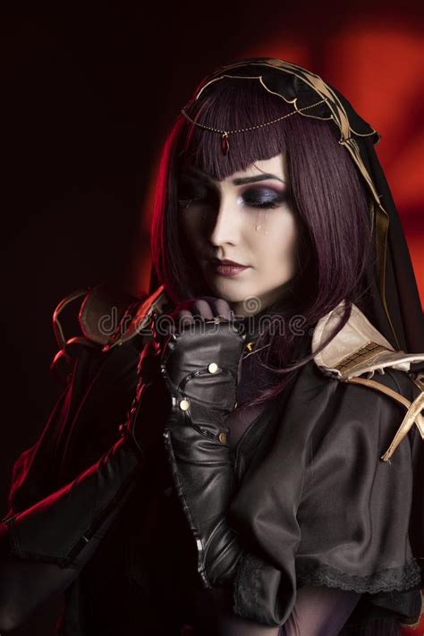 A Beautiful Busty Cosplay Girl Wearing An Erotic Leather Costume Sensually Cries With Tears In