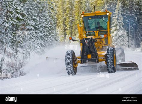 A Grader Plowing Snow Stock Photo Alamy