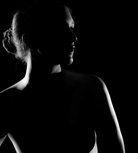 A Black And White Photo Of A Woman S Back