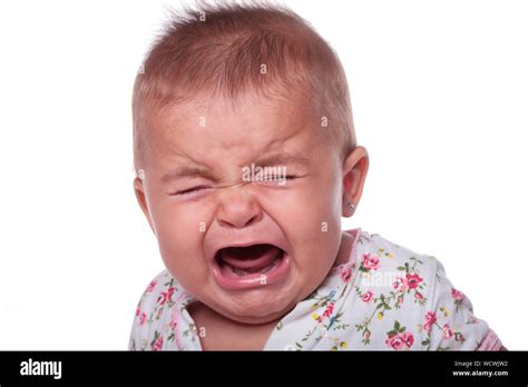 Portrait Of Crying Baby Against White Background Stock Photo Alamy