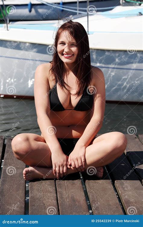 Woman Sitting In Black Bikini In Yacht Harbor Stock Image My XXX Hot Girl