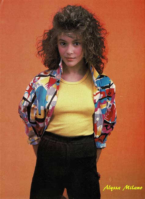 Rare Pinup Of Alyssa Milano Wearing A Yellow T Shirt Black Pants And Multi Color Button Down