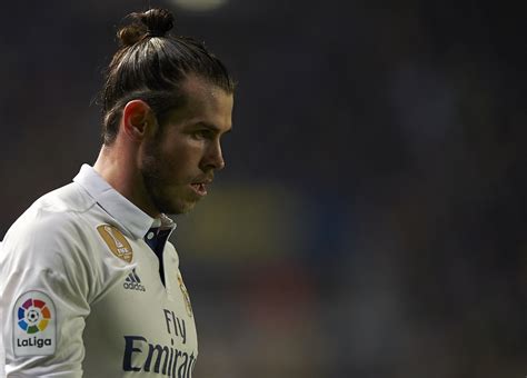 Bale gareth knot hair down wales georgia against wolf qualifying lengthy locks draw cup shows football readjust captain match had. El Clasico: Gareth Bale returns to Real Madrid training ...