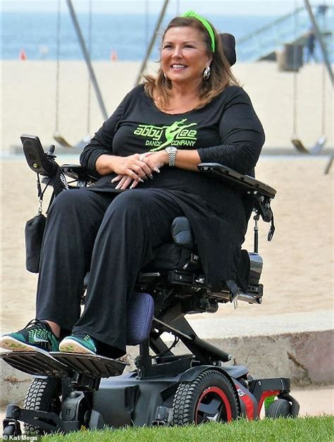 Dance Moms Abby Lee Miller Leans Back In Her Wheelchair As A Gymnast Somersaults Over Her 247